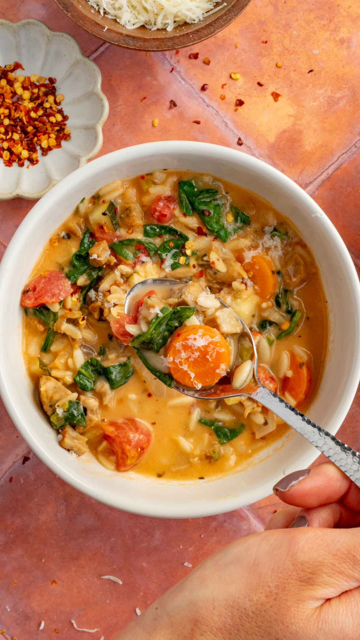 Creamy Parmesan Italian Sausage Soup in a white bowl 