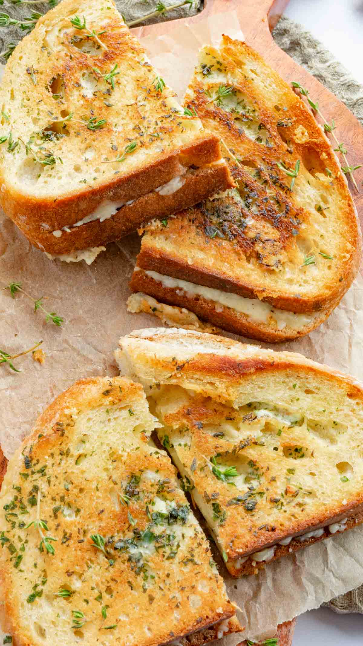 Sourdough grilled cheese sandwiches served on some brown parchment paper